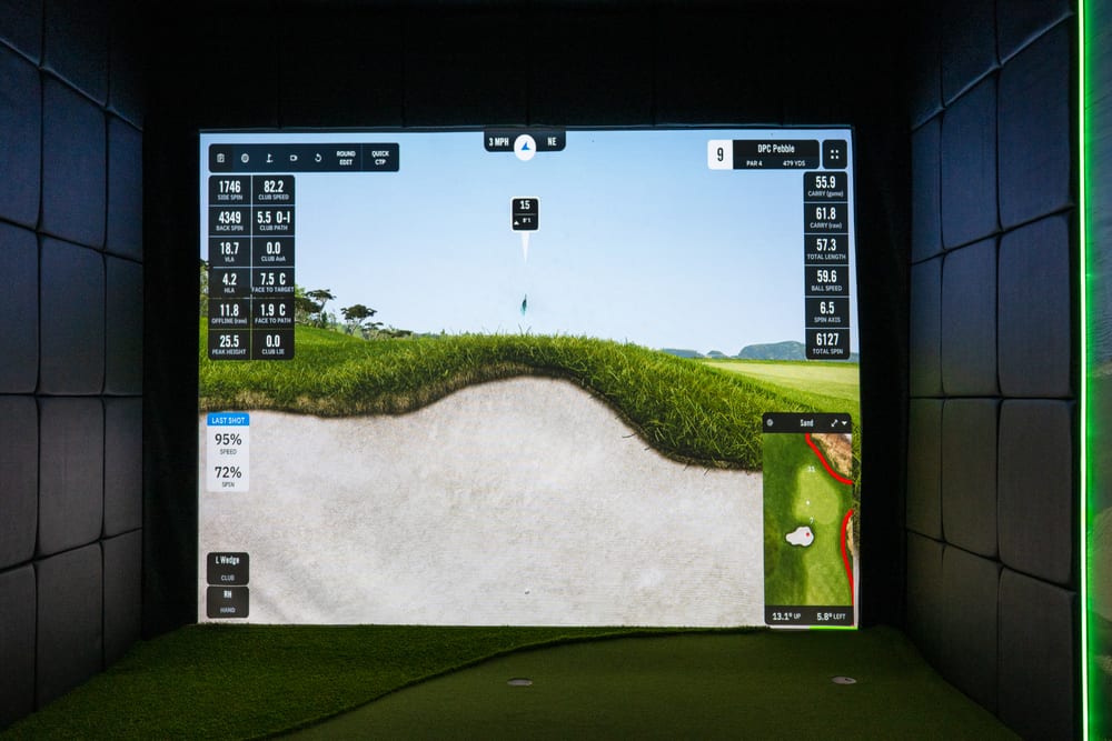 Simulator screen showing club selection, shot options and detailed performance data